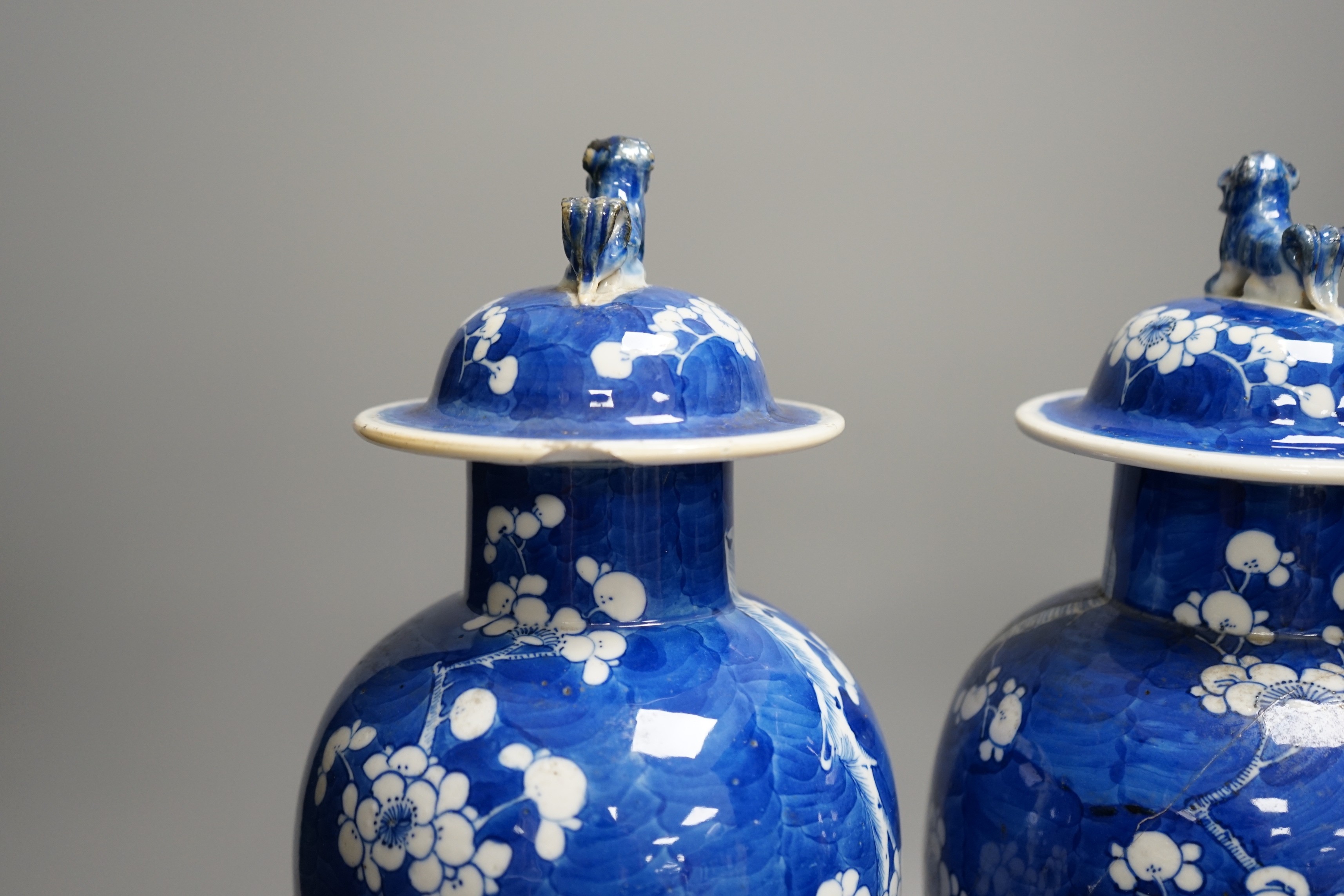 A pair of 19th century Chinese blue and white prunus vases, one a.f, 37cm